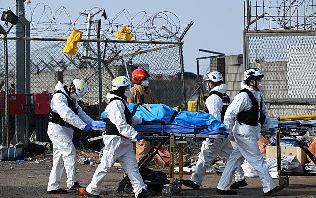 Rescuers operate at the site of an airplane crash at the Muan International Airport, some 290 km southwest of Seoul, South Korea, Dec. 29, 2024. (NEWSIS via Xinhua)