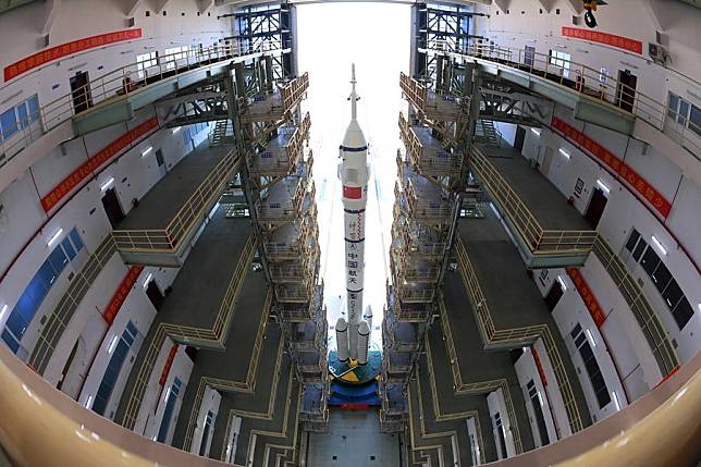 This photo taken on Oct. 22, 2024 shows the combination of the Shenzhou-19 crewed spaceship and a Long March-2F carrier rocket being transferred to the launch area. The combination has been transferred to the launch area, the China Manned Space Agency (CMSA) said on Tuesday. The spaceship will be launched at an appropriate time in the near future, the CMSA said. (Photo by Wang Jiangbo/Xinhua)