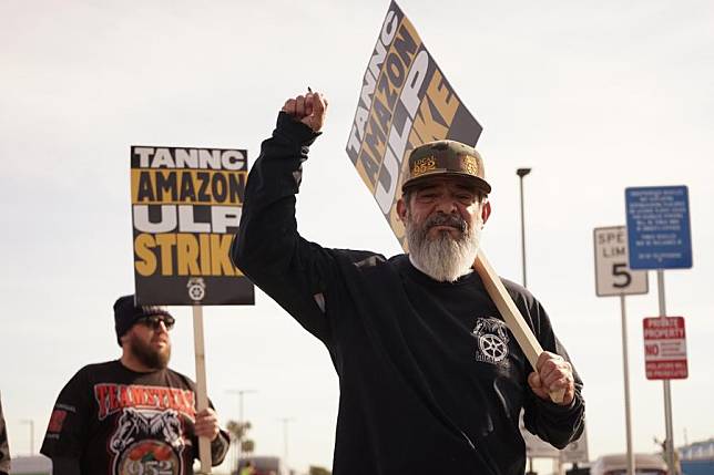 Amazon workers protest in front of an Amazon facility in the City of Industry, Los Angeles County, California, the United States, on Dec. 19, 2024. (Photo by Zeng Hui/Xinhua)