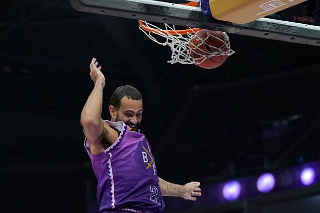 Grant Riller of the Beijing Royal Fighters dunks the ball during their match against the Jiangsu Dragons at the 2024-25 season of the Chinese Basketball Association (CBA) league in Beijing, China, on Oct.15, 2024. (Xinhua/Ju Huanzong)