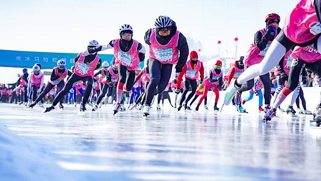 Participants compete during the first Jilin Songhua River Skating Marathon in Jingyu County, northeast China's Jilin Province, Jan. 30, 2024. The event attracted over 7,000 contestants from China and overseas. (Xinhua/Yan Linyun)