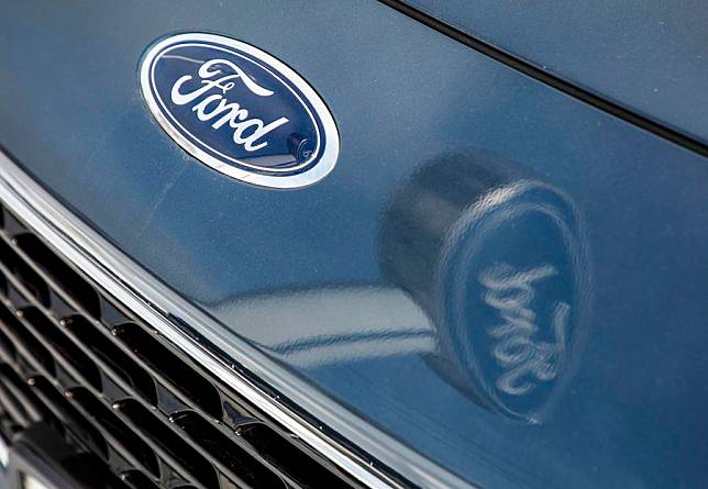 The sign of Ford is reflected on the hood of a vehicle at a Ford dealership in Libertyville, Illinois, the United States, on Jan. 6, 2021. (Photo by Joel Lerner/Xinhua)