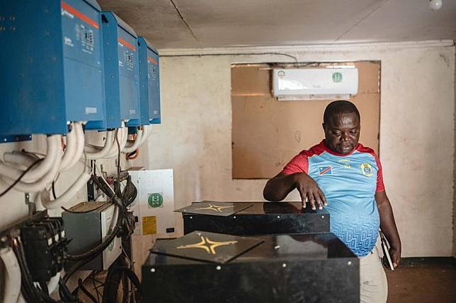 Vasco Hamisi checks solar power generation equipment in Kakuma refugee camp in Turkana, Kenya, June 19, 2024. (Xinhua/Wang Guansen)