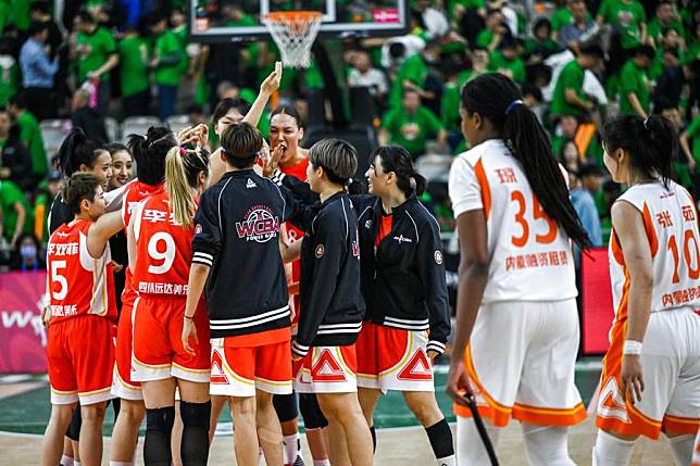 Sichuan players celebrate their win against Inner Mongolia in Game 1 of the Women's Chinese Basketball Association (WCBA) league Finals in Hohhot, north China's Inner Mongolia Autonomous Region on April 11, 2024. (Xinhua/Lian Zhen)