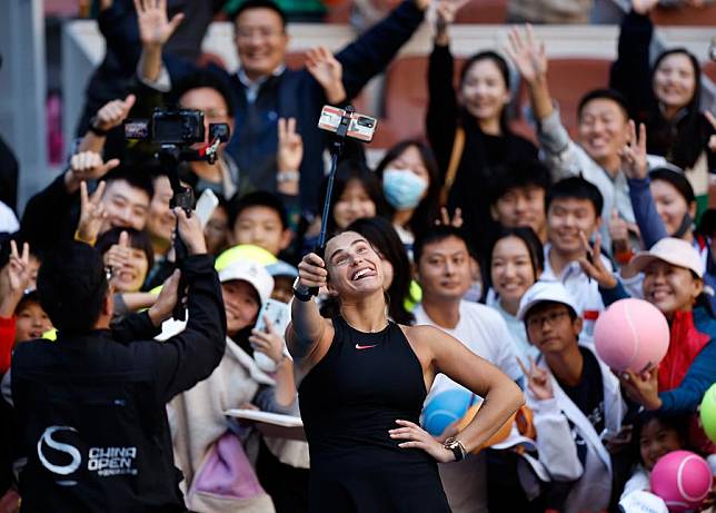 Aryna Sabalenka of Belarus takes selfies after winning the women's singles round of 16 match against Madison Keys of the United States at the 2024 China Open tennis tournament in Beijing, capital of China, Oct. 2, 2024. (Xinhua/Wang Lili)