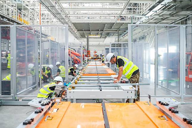 Constructors work at a construction site of the Audi-FAW new energy vehicle (NEV) project in Changchun, northeast China's Jilin Province, June 26, 2023. (Xinhua)