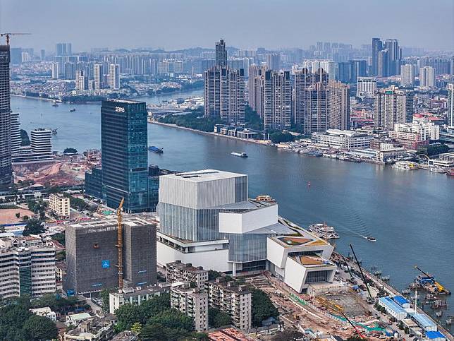 An aerial drone photo shows the Bai'etan Greater Bay Area Art Center under construction in Guangzhou, south China's Guangdong Province, Dec. 27, 2023. (Xinhua/Liu Dawei)