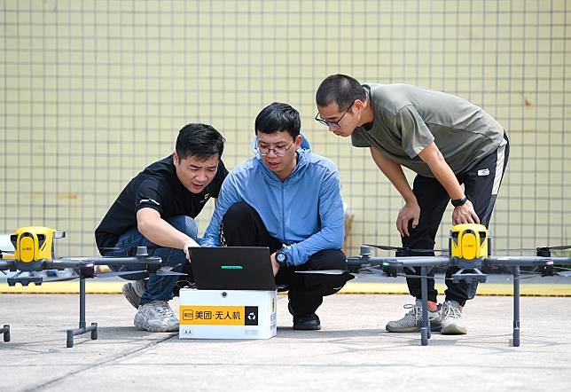 Luo Xikun &copy; and his colleagues conduct flight test on drones in Shenzhen, south China's Guangdong Province, April 12, 2024. (Xinhua/Mao Siqian)