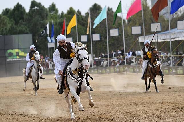 Horsemen compete during a tent pegging competition in Islamabad, Pakistan, Feb. 18, 2025. (Xinhua/Ahmad Kamal)