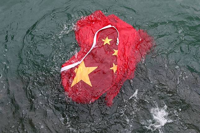 The Chinese flag was thrown into Victoria Harbour. Photo: Sam Tsang