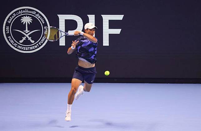 Shang Juncheng of China hits a return during the round robin match against Nishesh Basavareddy of the United States at the Next Gen ATP Finals tennis tournament in Jeddah, Saudi Arabia, Dec. 19, 2024. (Xinhua/Luo Chen)