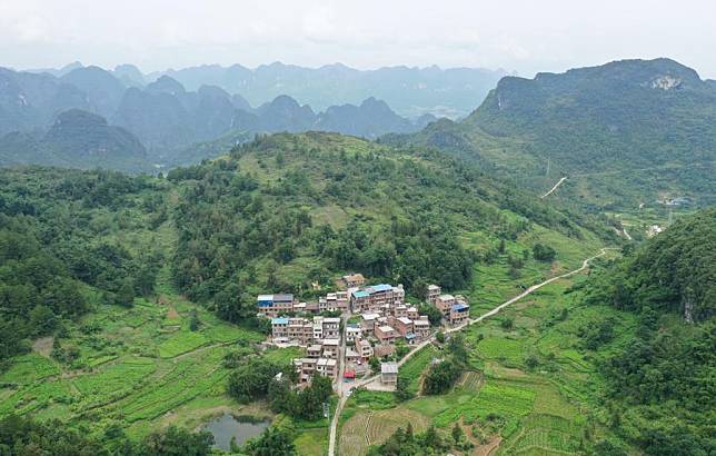 An aerial drone photo shows a hamlet in Xianan Township of Huanjiang Maonan Autonomous County, south China's Guangxi Zhuang Autonomous Region, Aug. 29, 2024. (Xinhua/Jin Haoyuan)