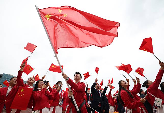 Members of the Chinese delegation attend the opening ceremony of the Paris 2024 Olympic Games in Paris, France, on July 26, 2024. (Photo by Cao Can/POOL/Xinhua)