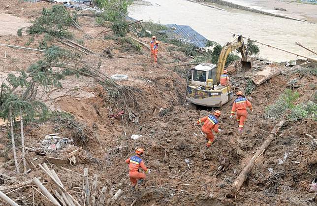 Firefighters work at Jiangwan Town of Shaoguan City, south China's Guangdong Province, April 22, 2024. Four people were killed and 10 others remain missing after continuous heavy rainfall hit many parts of south China's Guangdong Province in recent days, local authorities said Monday. (Xinhua/Lu Hanxin)