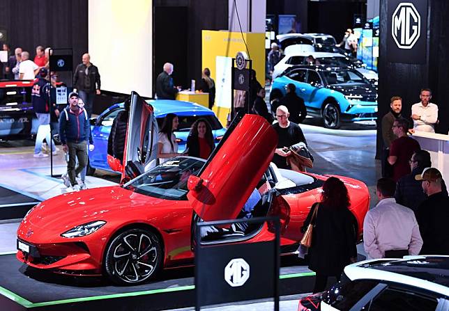 People view a car developed by Chinese manufacturer MG Motor at the Auto Zurich 2024 in Zurich, Switzerland, Nov. 8, 2024. (Xinhua/Lian Yi)