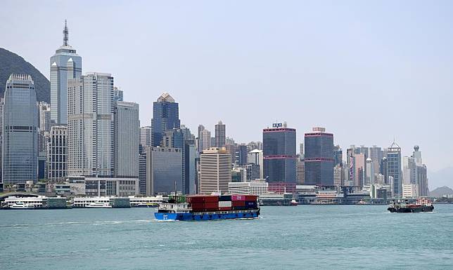 A container barge sails in the Victoria Harbor in Hong Kong, south China, April 30, 2023. (Xinhua/Chen Duo)