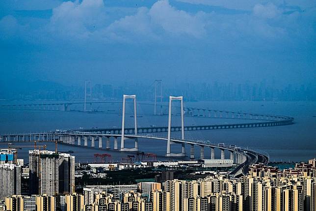 This photo taken on June 19, 2024 shows the Shenzhen-Zhongshan Link in south China's Guangdong Province. The Shenzhen-Zhongshan Link, a mega cross-sea passage in south China that features two bridges, two artificial islands, and an underwater tunnel, opened to traffic at 3 p.m. on Sunday. (Xinhua/Liu Dawei)