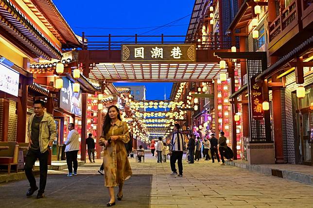 People visit a night market in Emin County, Tacheng Prefecture, northwest China's Xinjiang Uygur Autonomous Region, May 29, 2024. (Xinhua/Ding Lei)