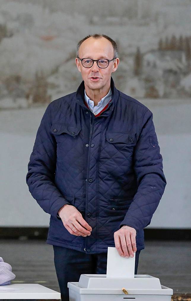 Friedrich Merz, chairman of Germany's Christian Democratic Union, votes at a polling station in Arnsberg, Germany, Feb. 23, 2025. German voters went to polls Sunday to decide the composition of the next Bundestag, the country's lower house of parliament. (Xinhua/Zhang Fan)