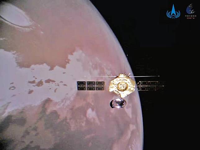 Photo released on Jan. 1, 2022 by the China National Space Administration (CNSA) shows the Tianwen-1's orbiter and Mars. (CNSA/Handout via Xinhua)