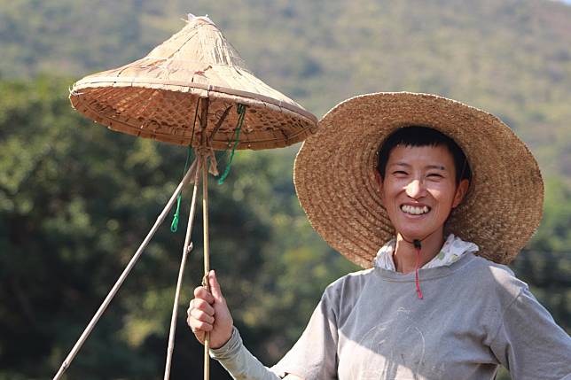 Artist and farmer Monti Lai in Lai Chi Wo Village, Sha Tau Kok, with her installation that pays homage to the village farmers for the art exhibition ‘MurMur of the Brick, Rurally Engaged Art’. Photo: Annemarie Evans