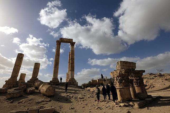 Tourists visit the Citadel archaeological site in Amman, capital of Jordan, on Dec. 27, 2024. (Photo by Mohammad Abu Ghosh/Xinhua)