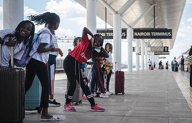 Children wait to board a train at the Nairobi Station of the Mombasa-Nairobi Railway in Nairobi, Kenya, Oct. 6, 2023. (Xinhua/Wang Guansen)