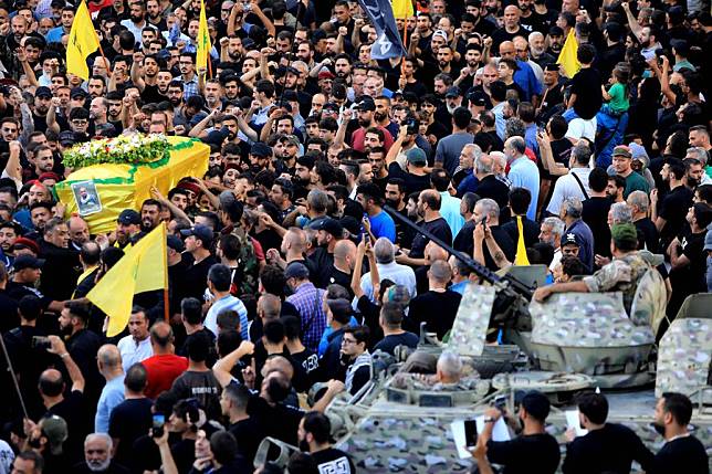 People attend a funeral of those who were killed in pager explosions in Beirut, Lebanon, on Sept. 18, 2024. (Xinhua/Bilal Jawich)