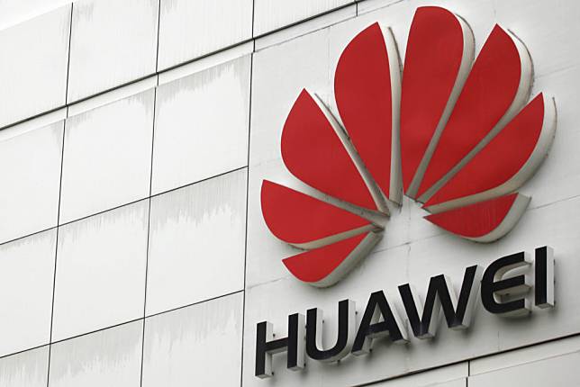 FILE PHOTO: The logo of the Huawei Technologies Co. Ltd. is seen outside its headquarters in Shenzhen, Guangdong province