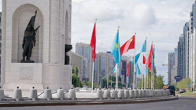 Chinese and Kazakh national flags are seen hoisted in Astana, Kazakhstan, July 2, 2024. (Xinhua/Wang Jianhua)