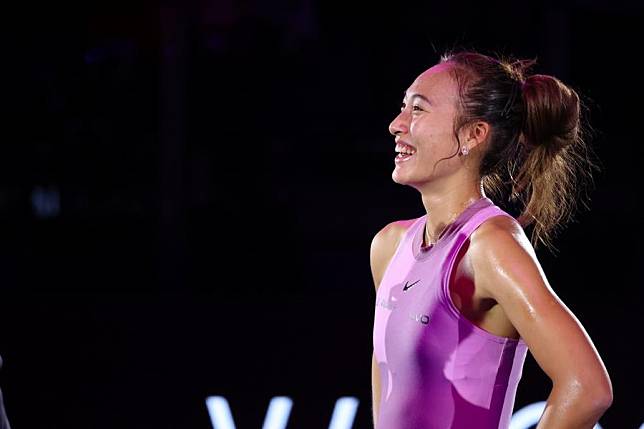 Zheng Qinwen reacts after winning the round robin match against Jasmine Paolini of Italy at WTA Finals tennis tournament in Riyadh, Saudi Arabia, Nov. 6, 2024. (Xinhua/Wang Haizhou)