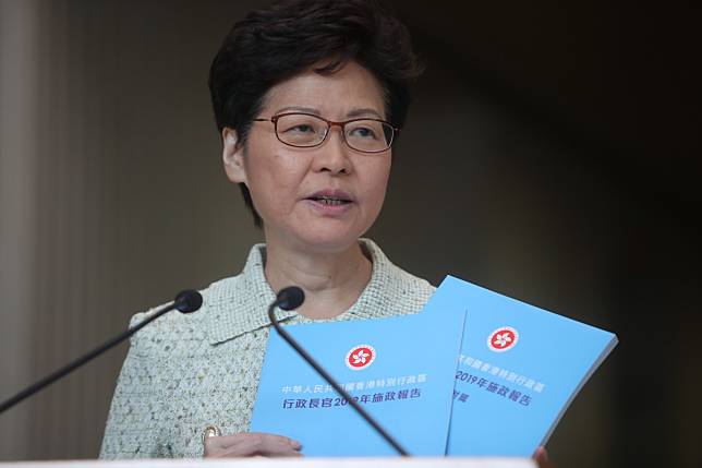 Hong Kong Chief Executive Carrie Lam presents the progress report that she will publish on Wednesday alongside her policy address. Photo: Winson Wong