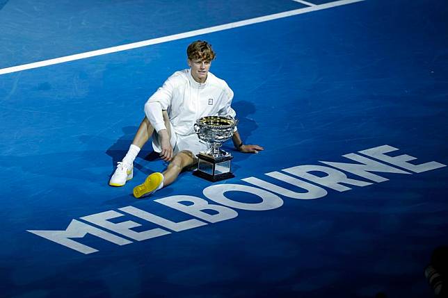 Jannik Sinner poses with the trophy at the awarding ceremony after the men's singles final against Alexander Zverev of Germany at Australian Open tennis tournament in Melbourne on Jan. 26, 2025. (Xinhua/Chu Chen)