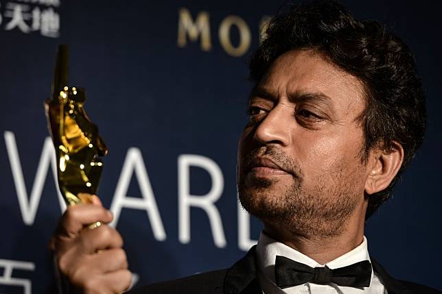 Indian actor Irrfan Khan poses with his trophy during the Asian Film Awards in Macau. The star died of cancer in Mumbai on Wednesday. Photo: AFP