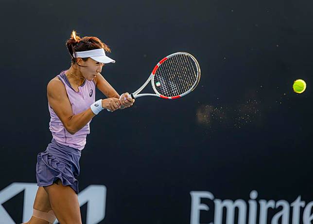 Gao Xinyu of China hits a return during the women's singles first round qualifying match against Anouk Koevermans of the Netherlands at the Australian Open in Melbourne, Australia, on Jan. 7, 2025. (Photo by Chu Chen/Xinhua)