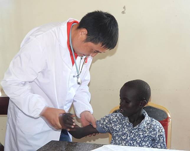 A doctor from the 12th Chinese medical team examines a child at the Juba Orphanage in Juba, South Sudan, Sept. 28, 2024. (Photo by Denis Elamu/Xinhua)