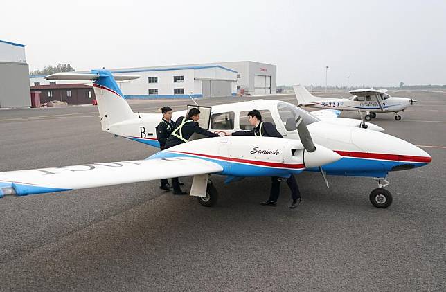 Flight trainees check the condition of aircraft before training at Dagao General Airport in Binzhou, east China's Shandong Province, Oct. 9, 2024. (Xinhua/Yang Shiyao)