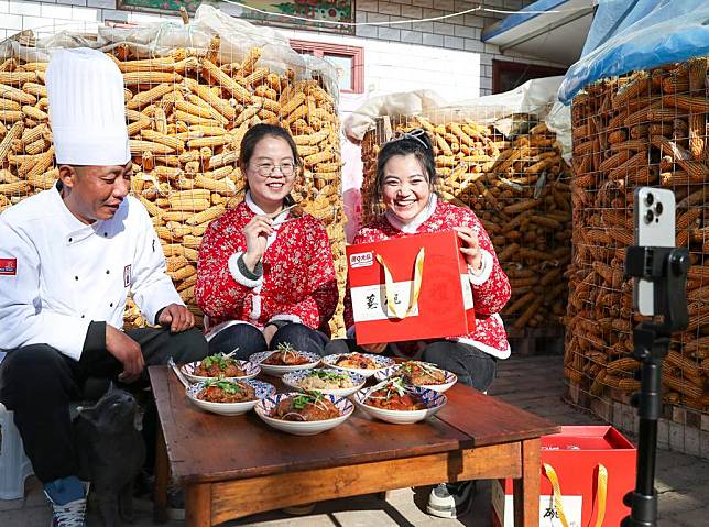 Members of a local e-commerce studio promote local products via live-streaming in Tangqi Village of Heshui County, Qingyang City, northwest China's Gansu Province, Jan. 5, 2025. (Xinhua/Lang Bingbing)