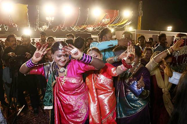 People dance during a mass wedding ceremony in Karachi, Pakistan, Jan. 12, 2025. (Str/Xinhua)