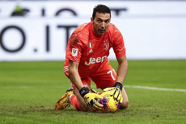 Juventus goalkeeper Gianluigi Buffon grabs the ball during the Coppa Italia semi-final first leg football match against AC Milan. Photo: AFP