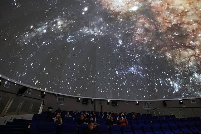 People watch a digital dome screen film at an experience planetarium in Kedu Town of Pingtang County, southwest China's Guizhou Province, Feb. 18, 2025. (Xinhua/Ou Dongqu)