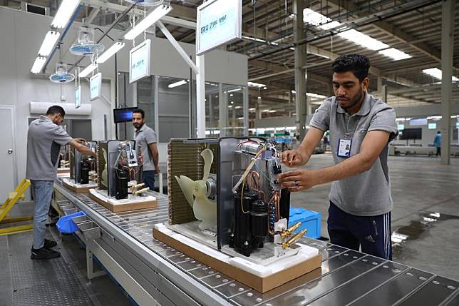 Laborers work on an air-conditioner production line at a factory of the Haier Egypt Ecological Park in the 10th of Ramadan City, Sharqia Province, Egypt, on May 1, 2024. (Xinhua/Ahmed Gomaa)
