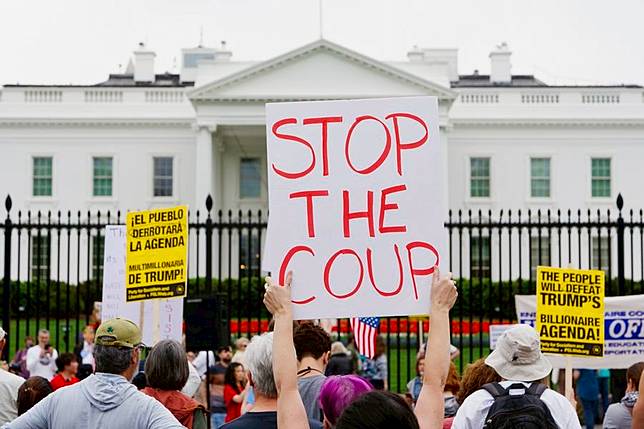 Protesters gather during a rally outside the White House in Washington, D.C., the United States, April 19, 2025. (Photo by Aaron Schwartz/Xinhua)