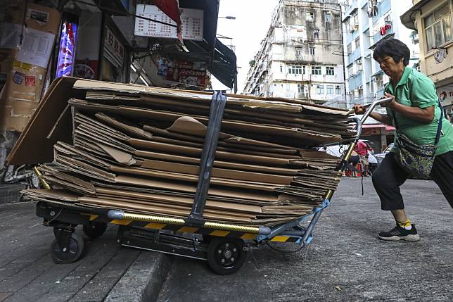 A cardboard granny puts on the new Polytechnic University trolleys through its paces in To Kwa Wan. Photo: Dickson Lee