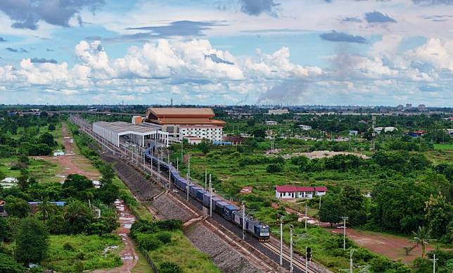 In this aerial drone photo, a fully loaded train leaves Vientiane station in Vientiane, Laos, and heads for Kunming, southwest China's Yunnan Province, Aug. 5, 2024. (Photo by Yang Yongquan/Xinhua)