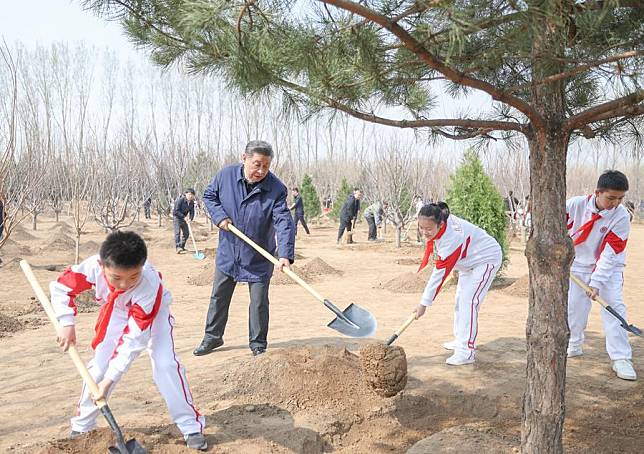 Chinese President Xi Jinping, also general secretary of the Communist Party of China Central Committee and chairman of the Central Military Commission, plants a tree during a voluntary tree planting activity in a forest park in Tongzhou District in Beijing, capital of China, April 3, 2024. Xi and other leaders, including Li Qiang, Zhao Leji, Wang Huning, Cai Qi, Ding Xuexiang, Li Xi, and Han Zheng, arrived at the site in the morning and planted trees with local people. (Xinhua/Ju Peng)