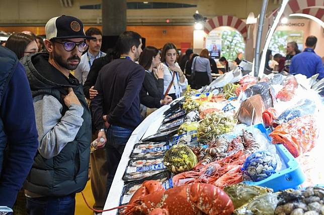 Visitors look at seafood at the 22nd Madrid Fusion in Madrid, Spain, on Jan. 30, 2024. (Photo by Gustavo Valiente/Xinhua)