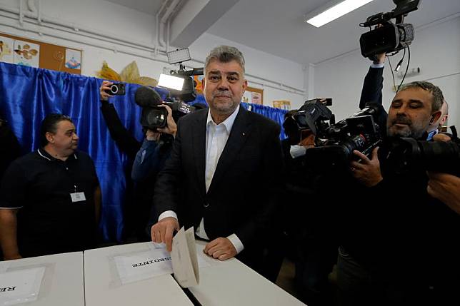 Romania's Prime Minister Marcel Ciolacu &copy; votes during the first round of the presidential elections at a polling station in Bucharest, Romania, Nov. 24, 2024. Romanians headed to the polls Sunday for the first round of the presidential election, choosing from 14 candidates to lead the country for the next five years. (Photo by Cristian Cristel/Xinhua)