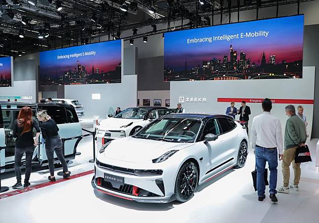 People visit the booth of Geely at the Automechanika in Frankfurt, Germany, Sept. 11, 2024.(Xinhua/Zhang Fan)