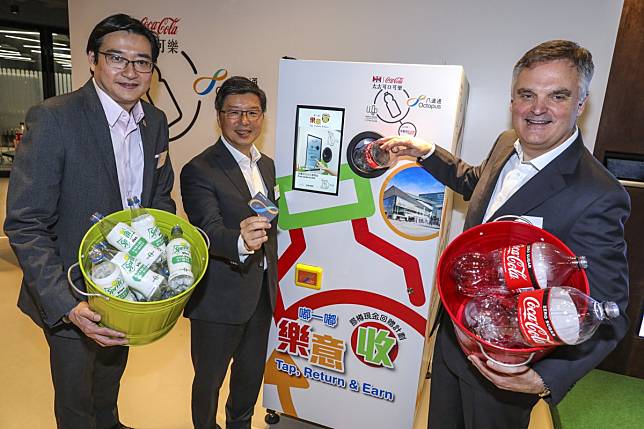 From left, William Yu, chief executive of World Green Organisation, Sunny Cheung, CEO of Octopus Cards, and Neil Waters, executive director at Swire Coca-Cola, at the launch of the reverse vending machines in Hong Kong on Thursday. Photo: May Tse